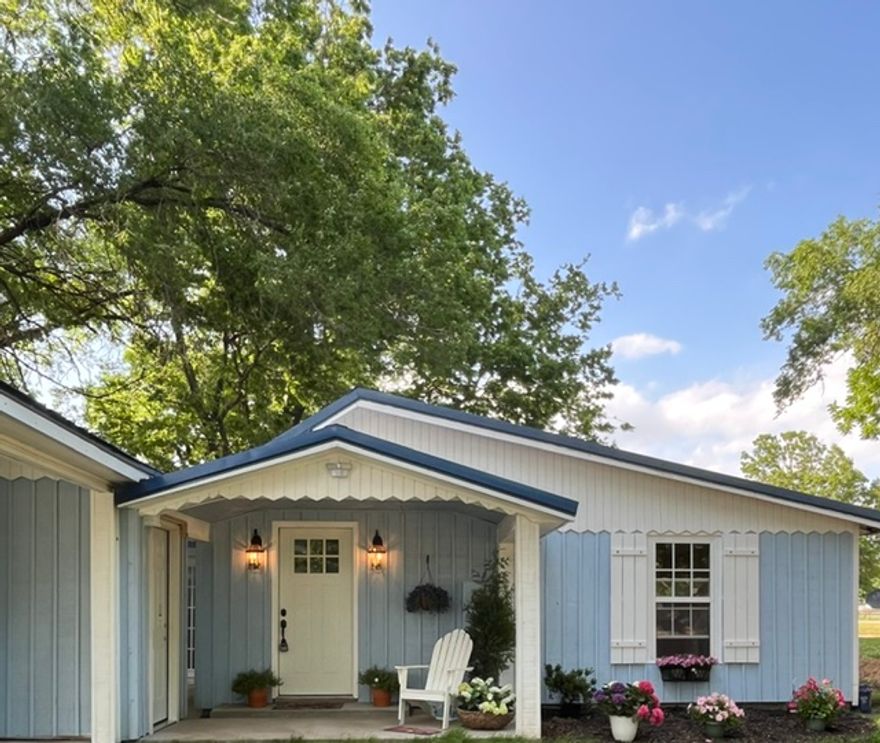 Charming, fully renovated farmhouse featuring 3 bedrooms, 2 bathrooms, and approximately 1300 sq ft., nestled on approximately 1.3 beautiful acres with mature trees and room for a garden.  This property offers the perfect blend of modern updates and country charm with large kitchen and separate dining area, 2-car covered carport, detached 1-car garage/shop, new HVAC, large utility/mudroom with ample closet space, large storage/bonus room and a storm shelter for added peace of mind. Located in the center of town, near the park.  This property provides room to relax, work and enjoy the outdoors.  Property also offers additional development potential with city-approved ability to split additional lots, and electric boxes already in place for two additional homesites; Buyer to verify all lot split and development opportunities with the city.
