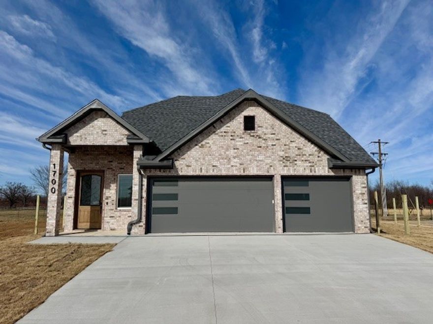 This stunning new construction 4-bedroom, 3-bathroom home offers the perfect blend of modern design, thoughtful upgrades, and an unbeatable location in a highly desirable neighborhood close to top-rated schools, shopping, dining, and commuter routes.  The home features a gourmet kitchen equipped with upgraded countertops, custom cabinetry, a center island with seating, designer tile backsplash, and premium appliances.  The spacious primary suite serves as a private retreat with a spa-inspired ensuite bath showcasing dual vanities, a walk-in shower, and a generous walk-in closet.  The exterior impresses with fresh landscaping, a covered patio ideal for entertaining, a privacy fenced yard and a three-car garage, making this move-in-ready home a rare opportunity in a prime location.