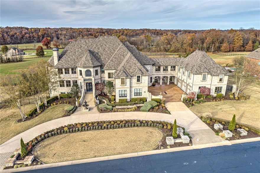 Exquisite luxury home situated on 2.19 acres in a gated subdivision. This palatial, one of a kind, 12,230 sq ft estate comes mostly furnished. Chef's kitchen includes service for 24. Every room exudes opulence and stunning detail. Specialty rooms include: office, library, theater with platform seating, tea room with water feature, butlers pantry, wine cellar with tasting room, safe room, sauna, and a garage featuring extensive workout equipment. There is also a separate apartment with a private entrance, the perfect mother-in-law quarters. This home even features an elevator location. Grounds are further enhanced by a resort-style pool including 4 waterfalls, infinity edge, in-water barstools, double sided fireplace, fire bowls, hot tub, covered outdoor kitchen, and eating area. The following items are new or were recently installed: Roof, 3 HVAC's, water heater, pool system pumps and electronics, dishwasher. Please see the extensive amenity list that highlights the custom features room-by-room.