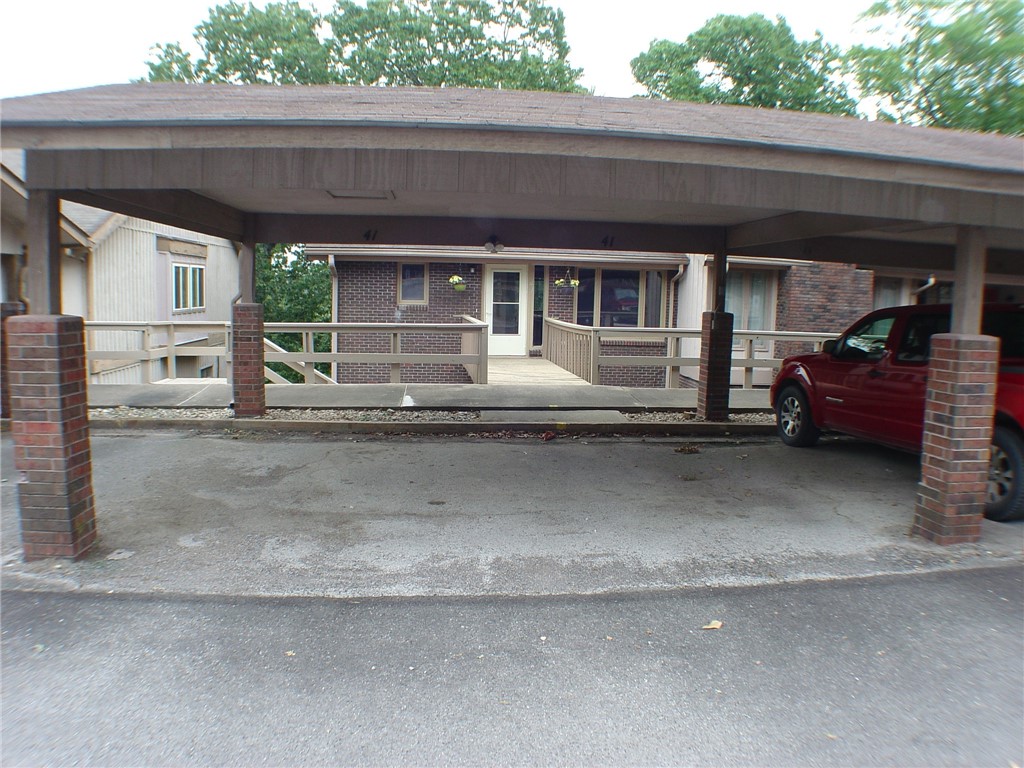 End unit townhome with double carport for protected parking! Wood laminate flooring with carpet in bedrooms. One bedroom and full bath on main level. Other bedrooms and full bath on lower level. Please note, one bedroom does not have a closet, but storage area is connected to it. Nice sized family, hobby room or large office space on lower level. Great location with ease of access to town center or the highway.