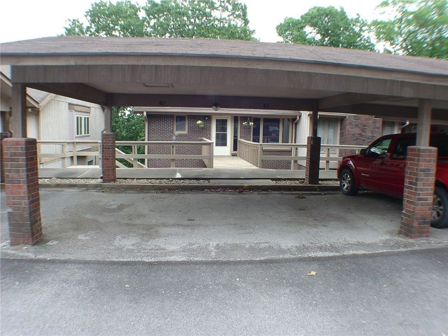 End unit townhome with double carport for protected parking! Wood laminate flooring with carpet in bedrooms. One bedroom and full bath on main level. Other bedrooms and full bath on lower level. Please note, one bedroom does not have a closet, but storage area is connected to it. Nice sized family, hobby room or large office space on lower level. Great location with ease of access to town center or the highway.