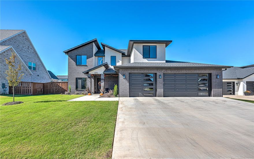 Modern home in the highly desired gated community of Scissortail! This stunning 4 bed, 4.5 bath home offers open living with engineered wood floors, crown molding, a tiled linear fireplace, and abundant natural light. The chef’s kitchen features a large accent island, quartz countertops, stainless steel appliances, gas range, double ovens, luxury lighting, pot filler, hidden walk-in pantry, and ceiling-height cabinets. The primary suite includes a spa-inspired bath with double sinks, soaking tub, oversized tile shower with rain head, and large walk-in closet. Main level also includes a private study and a guest bedroom with its own ensuite bath. Upstairs offers two spacious bedrooms—one with an ensuite bath—plus a large bonus room. Enjoy the huge covered patio, full sod, landscaping, sprinkler system, oversized three-car garage, and fenced backyard—perfect for relaxing or entertaining! Up to $5000.00 of Preferred lender credit available