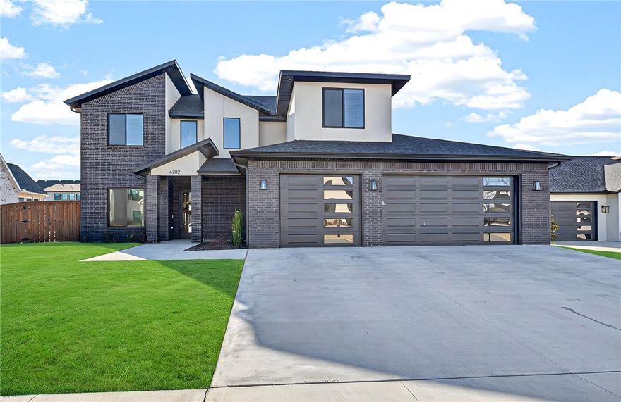 Welcome home to modern luxury in Scissortail—one of Northwest Arkansas’s premier gated communities! This stunning 4-bedroom, 4.5-bath residence blends high-end finishes with comfortable living near top-rated schools, trails, shopping, and dining. The open-concept layout features engineered wood floors, abundant natural light, and elegant design throughout. The chef’s kitchen impresses with a large quartz island, gas range, double ovens, designer lighting, and a hidden walk-in pantry. The main-level primary suite offers a spa-inspired bath with dual vanities, soaking tub, and rain-head shower. A private study and guest suite on the main level add flexibility for work or visitors. Upstairs includes two bedrooms—one ensuite—and a versatile bonus room. Enjoy a covered patio overlooking the fenced, landscaped yard with sprinklers. Oversized three-car garage. Scissortail offers resort-style amenities and a true community feel. Up to $5,000 in preferred lender credit—schedule your showing today!