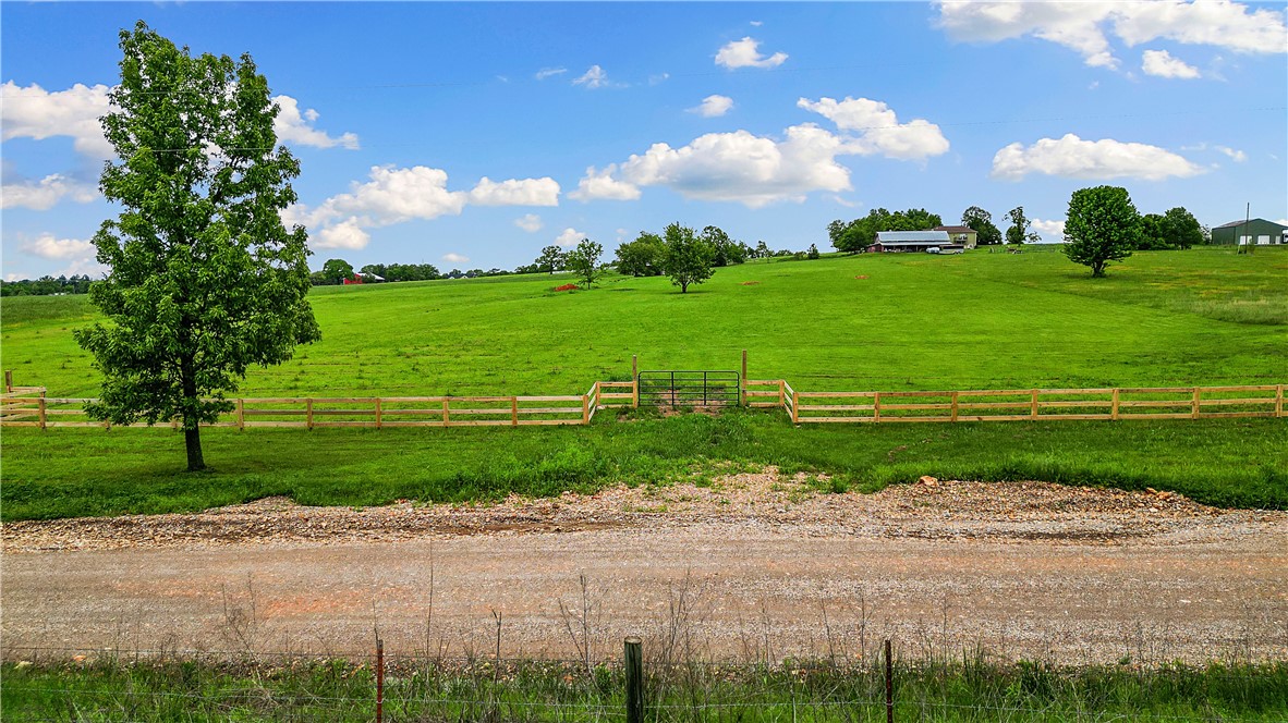 Discover the perfect blend of nature and convenience on this beautiful 5-acre level and open lot. Located just 4 miles from scenic Lake Wedington and 7 miles from the Siloam Springs Kayak Park. Whether you're looking to build your dream home, start a hobby farm, or simply enjoy wide-open space, this property offers endless possibilities. A perc test and septic design has already been completed for the property. Relax in the peaceful countryside while staying close to townājust 13 miles to Siloam Springs and 15 miles to Fayetteville. Enjoy the best of Northwest Arkansas with nearby outdoor recreation and the comfort of nearby city amenities. Property has a HOA with an ACC committee that would need to approve any building plans to ensure they align with the current environment to be consistent with the other homes in the area.