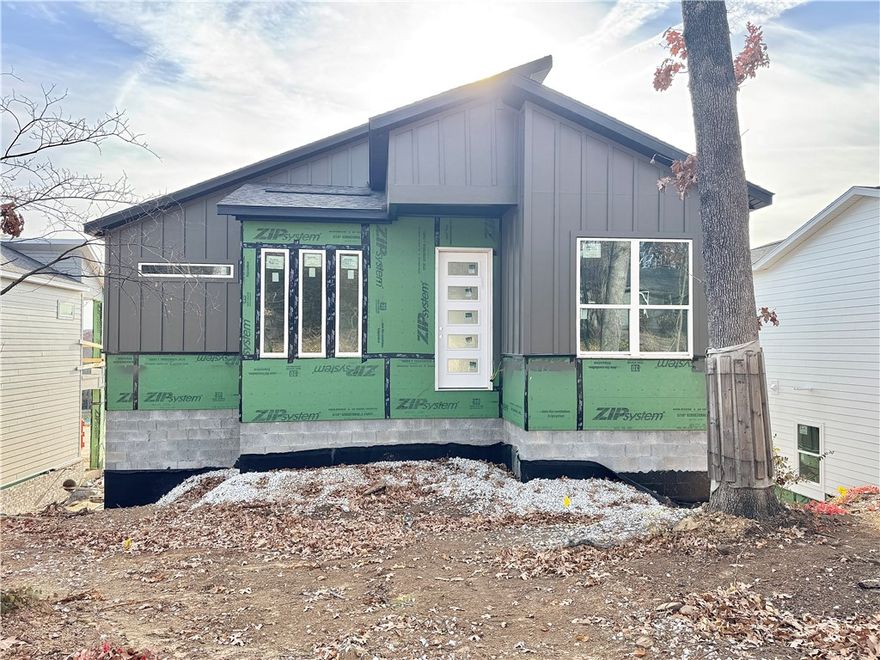 Discover this stunning modern home in the perfect East Fayetteville location—just a short walk to beloved Gulley Park! Malcom floorplan featuring designer finishes throughout. Enjoy a spacious open floorplan with a large living room, electric fireplace, custom beams, accent wall and beautiful wood flooring. The chef’s kitchen boasts 3cm quartz countertops, stainless steel frigidaire professional-grade appliances, custom cabinets to the ceiling with soft close hinges, vented hood, and a walk-in pantry. The luxurious primary suite includes hardwood floors, and a spa-like bathroom with walk in tile shower, soaking tub, double vanities and walk in closet. With a formal dining area, large covered balcony, extra storage and included blinds and gutters, this home blends comfort, style, and convenience in one unbeatable package. POA maintained lawncare!