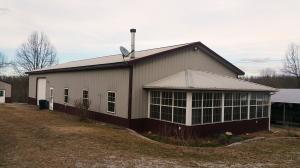This all metal exterior home has much to offer! Low maintenance, 2 or 3 bedroom home has over 1800 sqft, garage, lots of storage room, 24X30 shop building, 20x30 barn, and pond. All sitting on 30 acres in the Bergman school district! Must see!