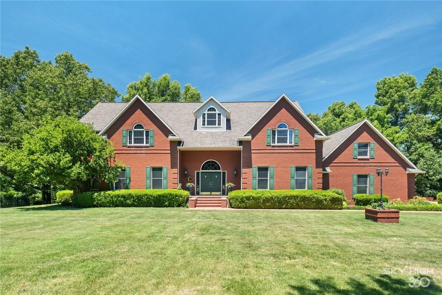 Own your own piece of heaven in this custom built one-owner executive home. Constructed using 2 x 6 Douglas fir, this rare find was built to stand the test of time. Situated on 20+ acres of grassland and wooded property, this is truly a private & serene setting - yet convenient to Children's NW, the U of A, and minutes from I-49 & all that NW Arkansas has to offer.

Walk in and be wowed by the grand entry hall with its gorgeous crystal chandelier, gracefully curving grand staircase, natural wood trims and gently arched doorways. 

The formal dining room is beautiful with a large bay window that allows natural light to fill the room and bounce off the highly polished hardwood flooring. 

Entertain in the large family room with floor to ceiling fireplace or outdoors on the covered deck, patio, or poolside.

Three levels of living, including Guest Room with en suite bath on the main level, master suite and 3 bedrooms on second level, and full basement perfect for game room, exercise, teenage gathering spot.