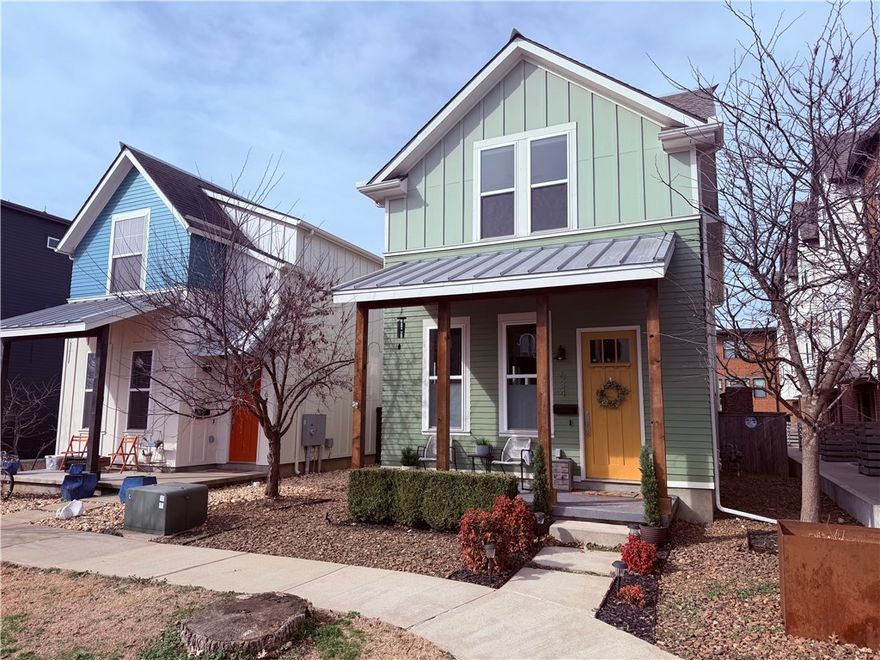 Enjoy the ease and energy of downtown Bentonville living in this charming Craftsman-style row home just blocks from the Square. Walk to restaurants, coffee shops, trails, and local events while coming home to a space that feels both stylish and comfortable. The interior is filled with natural light, high ceilings, and an open layout designed for everyday living and entertaining. A cozy fireplace with custom built-ins anchors the main living area, while the open kitchen features a large breakfast island, gas range, and generous pantry. The main level includes a full bath and a flexible bedroom—ideal for guests or a home office. Upstairs, two private bedroom suites offer walk-in closets and ensuite baths, plus a bonus living area perfect for relaxing or working from home. Outside, enjoy an expanded patio with a wood-burning fireplace and cedar pergola. A full-size, two-car detached garage completes this downtown retreat.