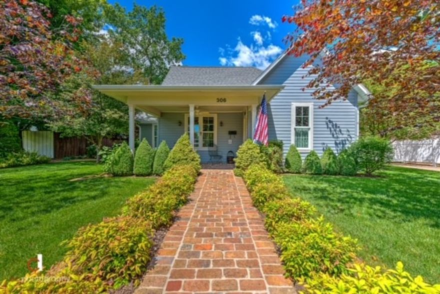 Spectacular curb appeal in sought after downtown Bentonville. Close to everything on the Square, yet with a secluded feel on a large .30 AC lot with mature landscaping. Home was essentially rebuilt in 2013. Total combined SF of home and rental cottage is 2465. Home is 2bd/2ba + office (1870 SF) and detached, income producing cottage is 1bd/1ba (595 SF). Home has original hardwood floors in living room and office, carpet in bedrooms and stained concrete in all other rooms. Large laundry room has tons of storage, desk and a sink. Attached, over-sized 2 car garage has a kitchen complete with fridge, range, microwave and cabinets. French doors separate the living room and office, which leads to the master suite, and another set separates the living room and dining room. French doors also leads to the spacious, private courtyard with a custom built brick FP and built-in cooking bar. Side yard has an outdoor shower, raised garden beds, and a small storage cabinet. This is a great living space in a fabulous neighborhood.