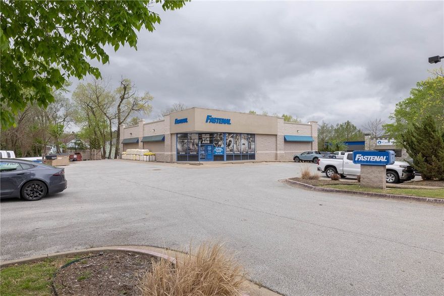 The building contains approx. 6,700 sf, with 12' high ceilings and is clear span throughout.  The building is a "blank slate" and can re-purposed with minimal interior demolition.  33 on-site parking spaces.  Approx 1/4 acre park-like setting behind the building.
Great location in rapidly growing SoFay (south Fayetteville).  Across the street is the South Yard project, consisting of 128 apt units plus retail, food, & beverage, & other businesses.  Adjacent to the sw are the Varsity House and Grove apartments, consisting of 224 units.  Immediately to the east and north are hundreds of relatively new attached and detached housing units.  Downtown Fayetteville, Fay High Sch. and the Univ of Arkansas are all just a short drive away.  Triple Net lease.