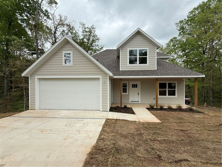 Welcome to your new home! This beautifully designed two-bedroom, two-bath residence offers a perfect blend of comfort and style across two spacious stories. The layout creates a natural flow between the living and kitchen areas—ideal for everyday living.  Upstairs and down, you’ll find thoughtfully laid-out spaces filled with natural light and room to relax. The primary suite features a spacious walk-in closet, offering plenty of storage and convenience.  Step out back to enjoy a covered deck that overlooks a peaceful tree-lined setting, providing the perfect spot for morning coffee or winding down in the evening. With its inviting feel and serene surroundings, this home offers a cozy retreat you’ll love coming home to.