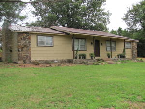 Beautiful redone home shines like new from top to bottom! With wood floors, a fireplace, a nice deck, gorgeous kitchen and nice new bathrooms, this home is the total package. There are even two living areas! All this comes on a huge 4.6 acre lot with nice trees and a peaceful setting!