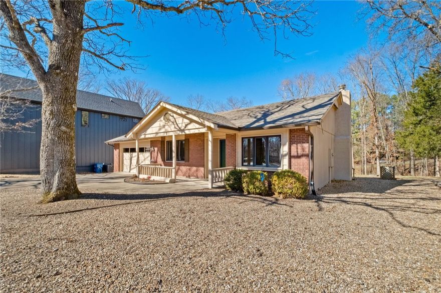 Beautifully maintained, one-owner 3 bed, 2 bath home in pristine condition, ideally located within walking distance to the Blowing Springs Greenway and Back 40 trails! Enjoy an open living room with gas fireplace, perfect for relaxing or entertaining. The kitchen and living spaces flow seamlessly, while the back deck offers a peaceful spot to unwind and watch the birds. Washer, dryer, and refrigerator convey for easy move-in. The mostly level, fully usable lot provides great outdoor space, and the garage includes built-in cabinets for extra storage. Recent updates include a new roof in 2022, and HVAC has been regularly serviced. A rare find offering comfort, convenience, and trail-side living—don’t miss this one! Please submit all offers to Kristie@12StonesNWA.com