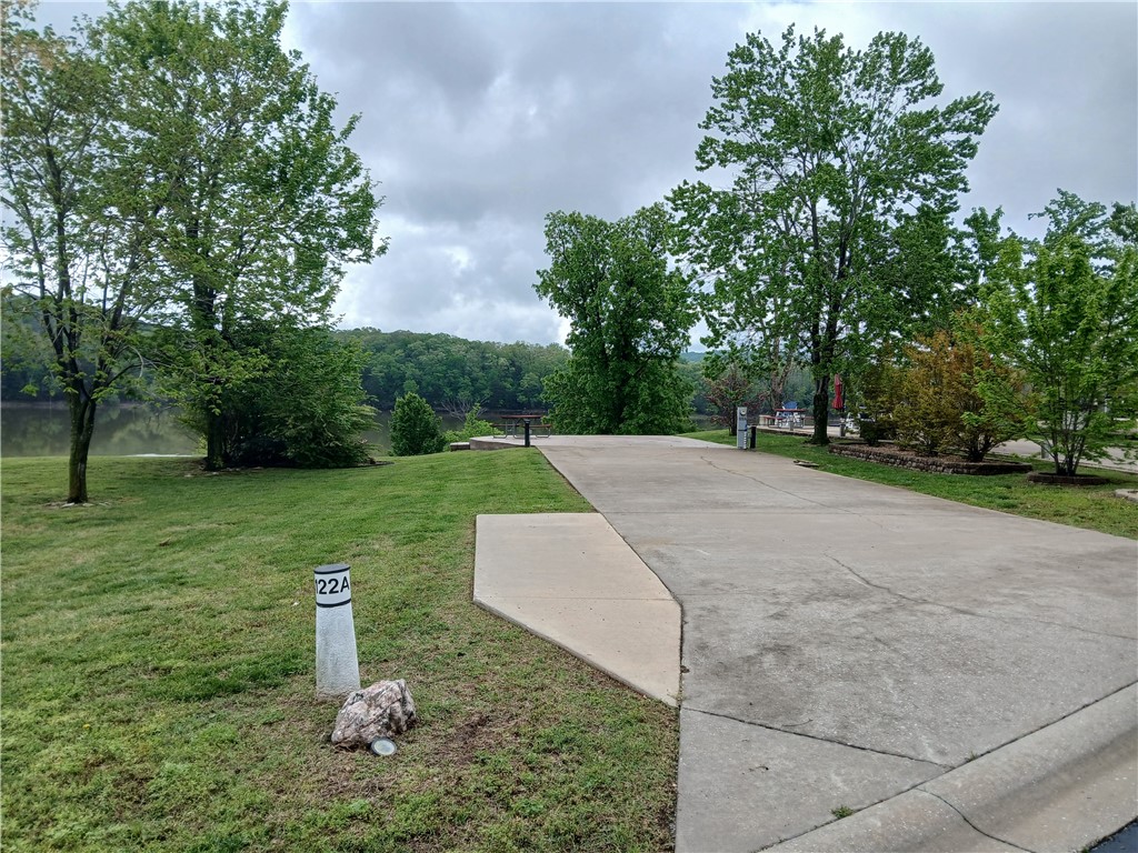 This is a Rare Find, you certainly don't want to miss this Extra Large Lot. Back into this level lot with easy access. Sit back and dream the day away with the incredible water front views . Accommodating your 45 ft RV and still leaving a Patio space at the waters front, situated perfectly for both privacy and long views at the back of the RV. Plenty of expansion room for creating gorgeous landscaping around your outdoor kitchen, or kicking back around a fire pit. Bring that new patio furniture and enjoy life at the Resort to the fullest potential this summer. The possibilities are endless, make your weekends memorable again at Table rock lake.
