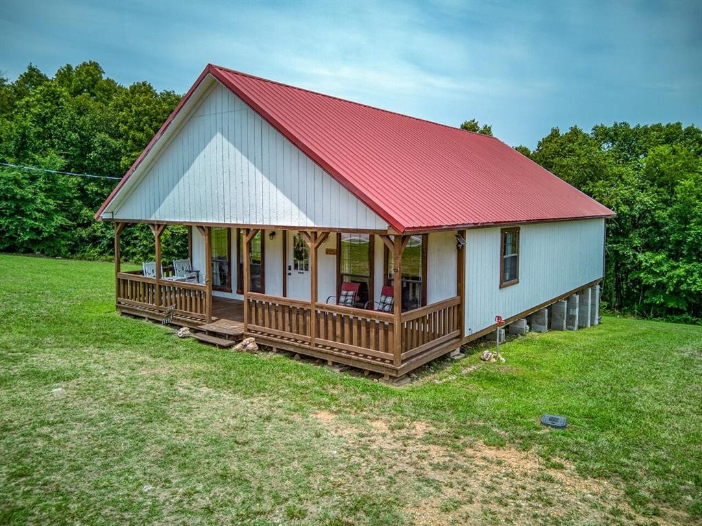 Simply Buffalo #1 is a beautifully furnished cabin featuring 1,260 square feet of living space sitting on 3.78 m/l unrestricted acres just a short drive away from Baker Ford, Woolum, Grinders Ferry, and all that the Ozarks has to offer her residents and visitors! Currently being operated as a successful nightly vacation rental, this cabin could continue on as such or be your new residence! The living quarters are all on one level and include 2 bedrooms, 2 full bathrooms, open concept living room, dining room, and kitchen! The home has 5 beds, sleeps 10, and comes mostly furnished! Turnkey is the word that comes to mind here!