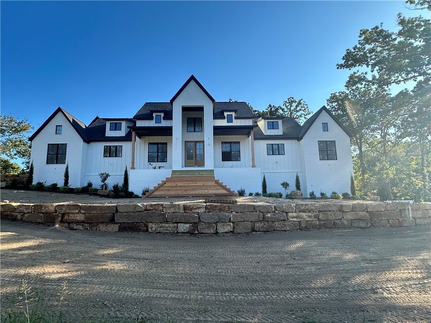 This custom built home offers everything...Come home to Shelby Forrest subdivision, NWA's new luxury getaway, large lots with lots of trees and privacy. Built on a large corner lot, this home offers an open floor plan, a gorgeous chef's kitchen, massive master suite with stunning walk in shower and a showstopper closet. The large upstairs bonus room has its own bathroom and could be a 6th bedroom. The sheer amount of closet and cabinet space will amaze you. Also features an office/5th bedroom, large laundry room and an outdoor patio space that will impress anyone. At this time, buyers could pick fixtures, flooring and more. Come see today.