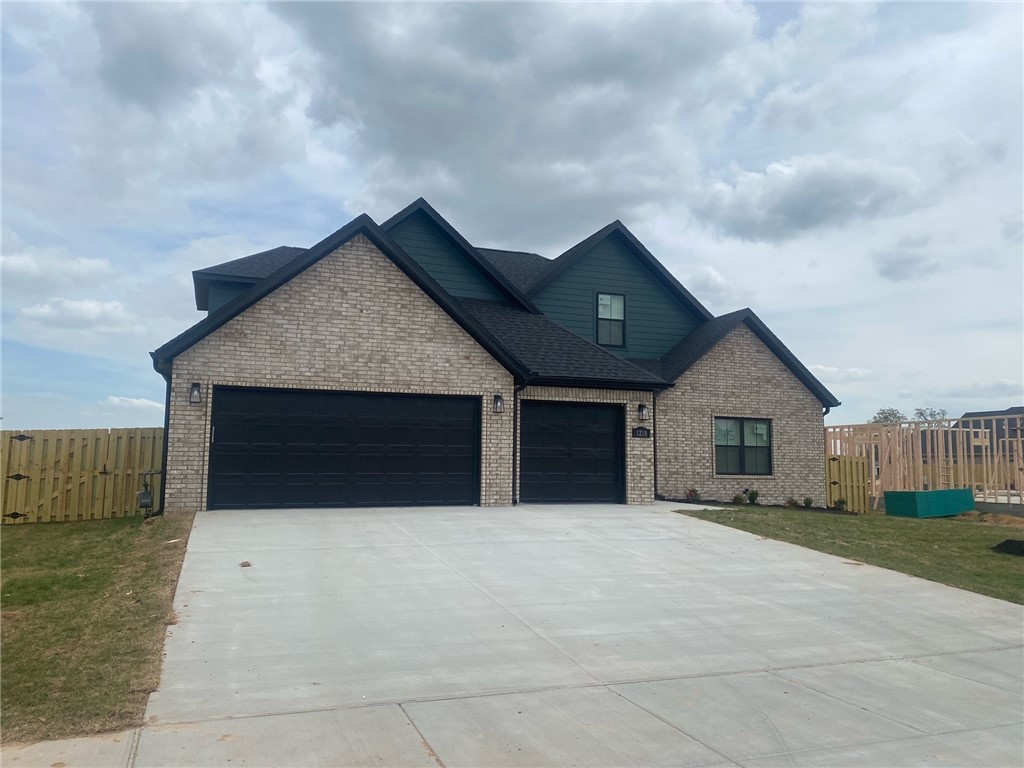 Discover your dream home in South Pointe Subdivision in Tontitown, where luxury meets convenience! This beautiful home offers a community pool, pavilion, and playground within the neighborhood. Close proximity to Arvest Ballpark, I-49, Arkansas Children's Hospital, Sam's Club, and countless restaurants ensure an ideal location. This 4-bedroom residence features a split floor plan with 3 bathrooms, boasting granite countertops, living room beams, custom trim, and a gas log fireplace. Enjoy the eat-in kitchen with a dining area, a large center island, and LED cabinet lighting. Step outside to the covered back porch, perfect for relaxation. Wood Fence, Blinds, and Gutters installed in house. Seller to provide up to $7,500 towards buyers closing costs or rate buy-down. Additional Preferred Lender Credit Credit of $3,250.