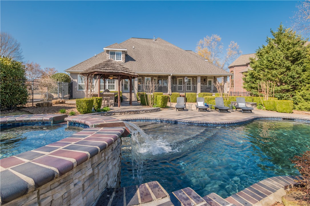 Perfect timing to make this private backyard oasis your own summer getaway! Relax next to the beautiful gunite pool with spa and waterfall and entertain your guests around the custom gas firepit or cabana with bar, built-in grill and mini refrigerator. This wonderful Pinnacle Country Club home offers a flexible floor plan featuring a private study with French doors, a large dining room w/butlers pantry and a gourmet kitchen with top of the line ss appliances & eat-in area that opens to the family room. Oversized master suite with sitting area, his/her closets and luxurious bathroom with soaking tub and jetted shower. The second level boasts 3 bedrooms all with w/in closets, 2 full baths, spacious media room and an additional living area or great flex space. A well appointed home featuring wood floors, 2 staircases, 3 fp and multiple living areas with delightful views of resort style backyard! Remarkable corner lot on .52 acres, side entry 3 car garage, circle driveway and lush professional landscaping!
