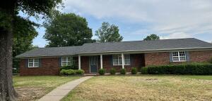 Here is your opportunity to purchase a wonderful home that has been well maintained in the Sherwood subdivision. This is a 3 bedroom, 2 bath home on a corner lot. Features include a storm shelter, covered back patio area, separate laundry room, lots of storage in the laundry and kitchen areas, two car garage and a large storage room for your gardening tools or whatever you choose. The refrigerator, washer and dryer convey with the purchase. New roof in Jan 2021 and new HVAC system in March of 2023. Home is being sold ''AS-IS''.