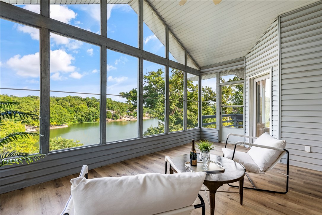 A perfect blend of luxury and natural beauty, this fully renovated lakefront retreat sits on the stunning shore of Loch Lomond. Two primary suites with walk-in closets make it ideal for multi-generational living or hosting guests. Upgrades include wood-plank LVP flooring, tile, a modern kitchen, new HVAC units, and water heater. Enjoy year-round views from the screened porch or private deck, then stroll the concrete path to the water for swimming, fishing, or kayaking. The kitchen overlooks the lake, complemented by a butler’s pantry and fully finished walkout basement. The oversized garage features a workspace for hobbies or gear. Mature zero-scape landscaping offers low maintenance. Residents enjoy a community dock, pool, and quick access to golf, trails, and other private lakes. This is more than a home—it’s a lifestyle on the water.