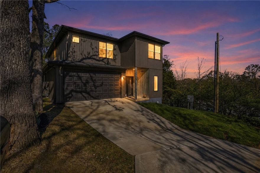 *Price Reduced* Offering this custom built home below appraisal of 590k. *Motivated Sellers*
If you love Razorback sports, but hate traffic, this is your house! Just step out your front door and head that way! Features 10’ ceilings on main level and open layout with rare oversized windows that let in all the natural light! Easy to maintain siding really sets this house apart from the surrounding area.  No repainting every few years. Smart home upgrades include smart light switches throughout, Z-Wave front door lock, and Wi-Fi sprinkler system. The current security cameras and DVR convey offering peace of mind when you are away. Kitchen offers quartz countertops and dedicated pantry; bathrooms feature granite countertops. Spacious primary suite includes soundproofing on street-facing wall. Ceiling fans with remotes in all rooms. Tankless water heater paired with traditional tank. Built with 2x6 walls for added efficiency. Large built-in shelves and desk. Full blinds throughout. Permanent shed conveys.