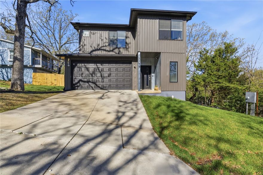 4 bed, 2.5 bath home located next to the University of Arkansas. Park at your own house for football or basketball games and even the Garland Center! It also has quick access to interstate 49.Features 10’ ceilings on main level and open layout with oversized windows. Smart home upgrades include smart light switches throughout, Z-Wave front door lock, and Wi-Fi sprinkler system. Pre-wired for security cameras; cameras and DVR convey. Kitchen offers quartz countertops and dedicated pantry; bathrooms feature granite countertops. Spacious primary suite includes soundproofing on street-facing wall. Ceiling fans with remotes in all rooms. Tankless water heater paired with traditional tank. Built with 2x6 walls for added efficiency. Large built-in shelves and desk. Full blinds throughout. Permanent shed conveys. Passed required HERS index rating for Fayetteville (report available).