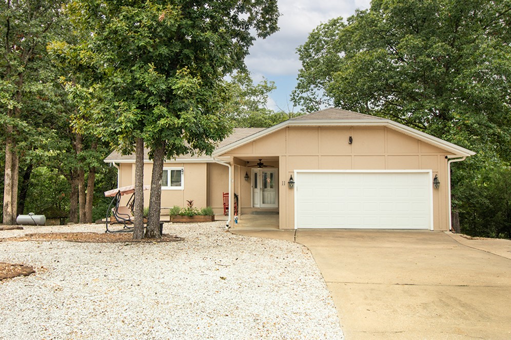 Spanning nearly 3,000 square feet, this two-level home is just half a mile from Hwy 71 and close to bike trails, Bentonville, and NWA amenities. It features three bedrooms and three full bathrooms, along with two living areas and bonus rooms for everyday comfort. The kitchen has been updated with newer appliances and leads to the living room and sunroom, which are flooded with natural light. The expansive downstairs offers flexible space, including a living area plus a game room/hobby area or workshop. This property combines ample living space with a desirable location in a quiet neighborhood. Don’t miss the opportunity to make this home your own.