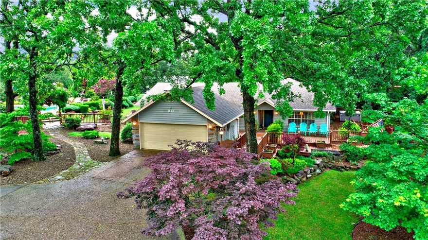 Fabulous home on 1.14 acres, IN TOWN, with amazing sunset views, gorgeous pool, wrap around decking & adorable 464 sq ft pool house/cottage. This beautiful home is open, spacious and perfect for everyday living or entertaining. Kitchen features granite countertops, stainless appliances, gas range-top, electric oven, but gas available, island & bar along w/abundant cabinetry. Large windows look out to the beautifully landscaped yard & 5' sport style self-cleaning pool, hot tub & even a greenhouse! Main house has 3 BR, 3 BA & pool house has 1 BR, 1 BA, KIT, LR. Home is updated w/pristine hardwood floors, newer HVAC system, whole house generator, instant hot water, decks, patios & is move in ready! KIT & PH refrigerators, PH Toaster Oven, Hot Tub, TV mounts, pool equipment convey w/property. Curtains are negotiable.  Sit down in the sunroom & you may never want to leave!