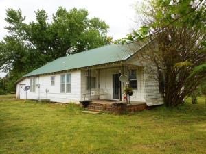 Possible Owner finance (below appraised value), two bedroom, two bath with a large yard/garden spot, w/in easy walking distance of a country convenience store (hot food, hardware, groceries, feed, gas, etc.) and post office.