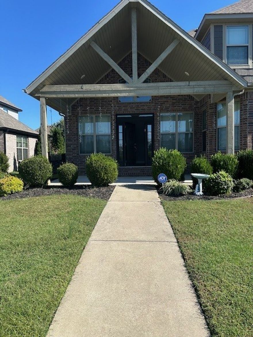 This stunning two-story home is located in a fantastic subdivision near I-49, schools, shopping, business centers and trails, offering both convenience and beautiful views. The main floor features a guest suite, open living areas and a gourmet kitchen with granite counters, gas cooktop and abundant storage, while upstairs you’ll find two bedrooms, a full bath, a spacious media room and a luxurious primary suite. With three garages, a fenced backyard with pergola.