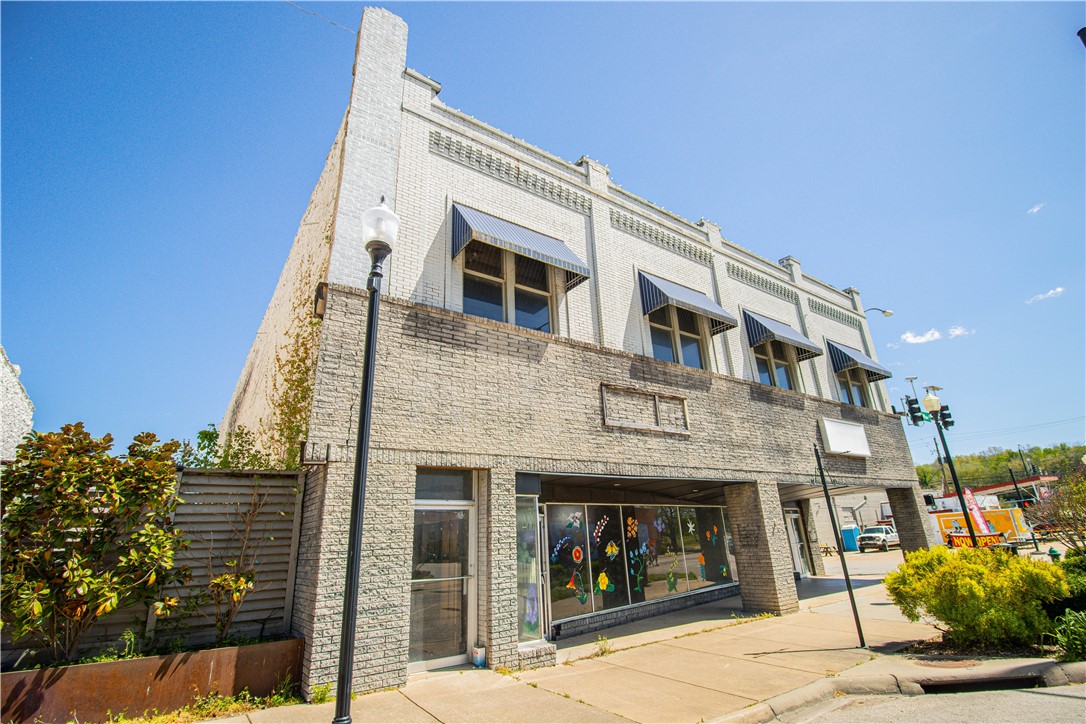 You can own a piece of Boone County, AR history with this amazing building. With over 14,000 total square feet the possibilities are endless. Property includes the gated lot between the buildings and is waiting for you to dream up that perfect outdoor space. Located in the middle of the Entertainment District and the corner of the Harrison Downtown square. This dream location does not come around very often. Don't miss your chance.