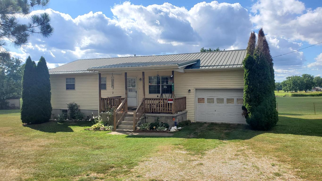 Come see this cute and cozy home with possible 5 bedrooms, 2 bathrooms on dead end paved road in Western Grove. Well maintained and ready for new owners, this home offers large level yard, metal roof, one car garage with detached garage/workshop with gravel floor, deck, covered porch, newer flooring, windows, A/C, water heater and more. Three possible bedrooms are located in the, semi-finished, walk-out basement.