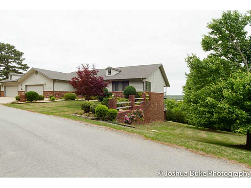 For $97 per sq. ft, you can own the most beautiful home on Beaver Lake in Rogers with breathtaking year round lake views. Completely remodeled. 2 masters, 4 bedrooms, 4.5 baths, bonus room, open plan, workshop in garage. Garage can hold 3 cars & trailer.,Boat slip available, sold separately!!!Beaver Lake access just 2 minutes away and minutes away from Prairie Creek Marina. 1800 sq. ft of decking from both levels to enjoy the views. Hot tub conveys. Minutes to downtown Rogers. Furniture negotiable.