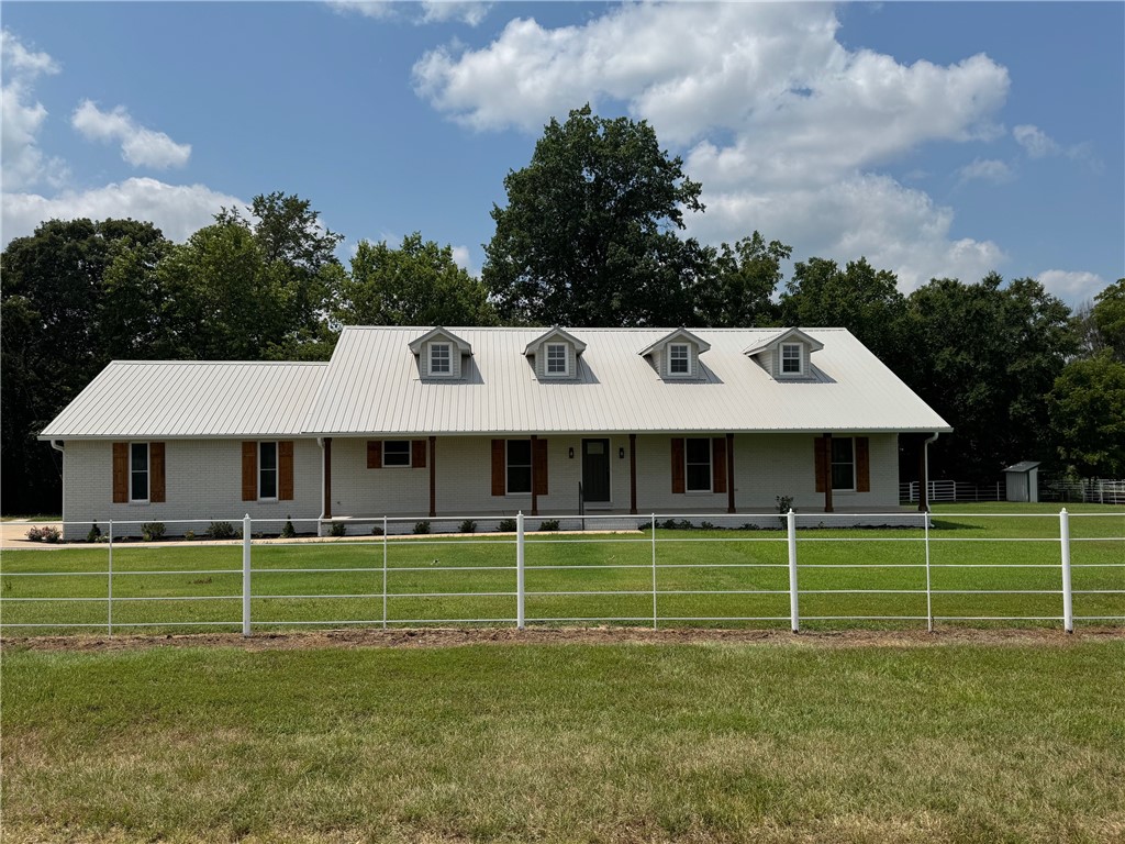 Here it is! A beautiful completely redone 3,208 sq. ft., 5 bedroom, 3 full bath home on 6.83 Acres in Farmington at the end of the lane. All new paint inside and out, complete premium wood vinyl floors throughout, new granite tops, new handicap toilets, new light fixtures and appliances, office. There is also a wood burning fireplace that is ducted to bedroom downstairs with thermostat, owners bedroom and two other bedrooms downstairs. Two very large bedrooms upstairs with full bath, new appliances, new gutters. Enjoy the large covered porch across the front with a beautiful view. White pipe fence and plenty of room for horses or cattle. There is a very good well also for unlimited watering for hobbies and/or animals. New insulated garage doors and openers. Very nice 16x32 inground pool with a new vinyl liner. Detached 24x48 shop with a very nice wood burning stove and 220. Also, detached 8x16 craft cabin/man cave. Open pasture with several large mature trees.