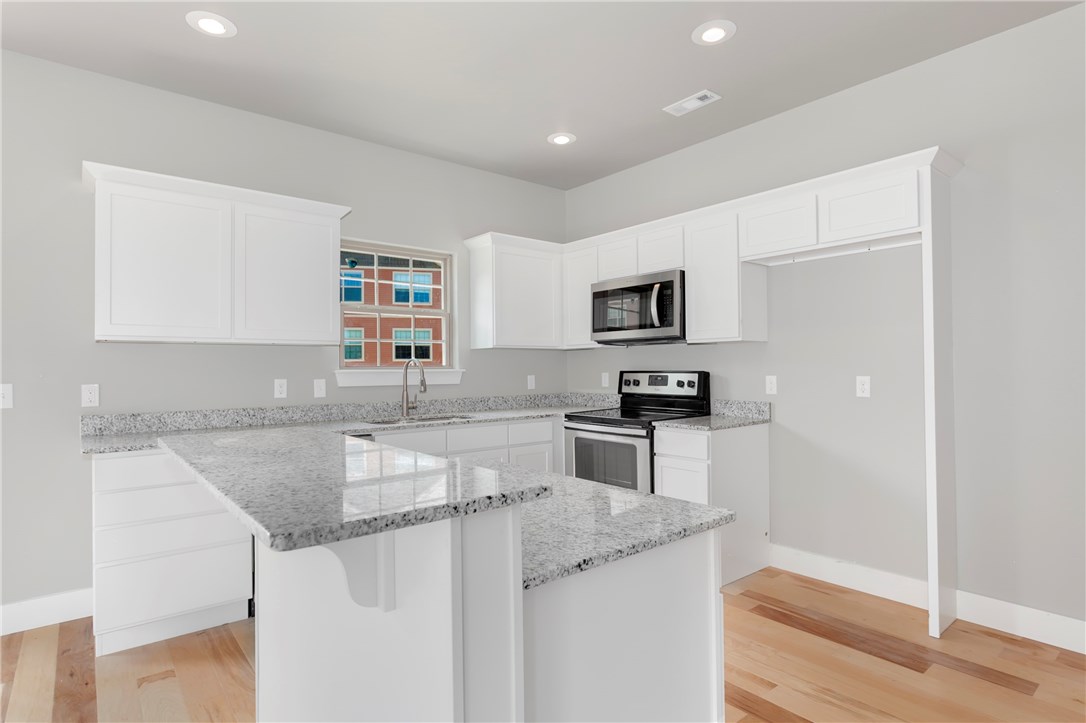 Wonderful new construction townhomes with plenty of upgrades & a great location at an affordable price! Close to U of A & easy access to I-49! Move in ready! Upgrades include 9 ft ceilings, Granite Countertops, White Oak Hardwood Floors, Porcelain tile, vaulted ceilings in bedrooms, oversized 2 car garage, walk-in closet, & more! Walk out deck off kitchen / living for entertaining and relaxing! Easy access to grocery stores, restaurants, bike / hike trails, & shopping centers. Views are great! Estimated completion is 6/1/2020. Photos from previous townhomes.