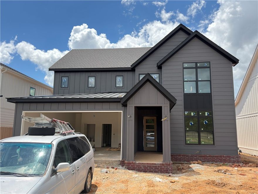 Gorgeous new construction home in best location in NWA! This plan features 4 bedrooms (2 down/2 up), 3 full baths, and 2 car garage. Kitchen is fully equipped with built-in oven, microwave, gas cooktop, walk-in pantry, and large island! Unwind in your peaceful primary bedroom with a soaking tub, large walk-in shower with dual shower heads, separate vanities, and large closet with tons of storage! Bedroom 2 and full bath are on other side of home on main level. Upstairs you'll find bedroom 3,4 and a full bathroom. Back covered patio makes a great place for the family to hang out and grill. Enjoy the Meadow Brook playground that is a short walk from this home or across Bellview you can access the Razorback Greenway Trail!