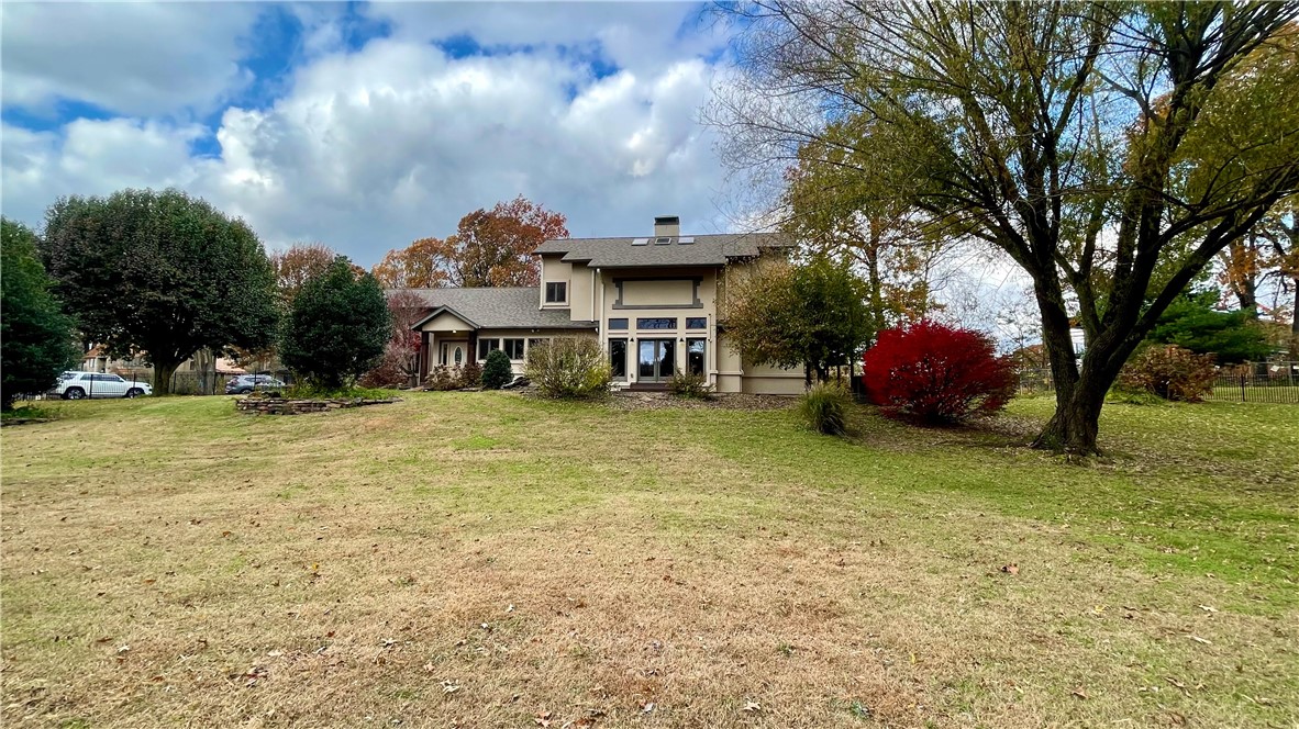 Perfectly situated in the heart of Rogers, is a one-of-a-kind, custom home adjacent to the Razorback Greenway & central to everything. Private and tranquil setting on 4 acres, is adorned by deer and wildlife. Currently being built behind the home is the #1 rated Charter School in AR. Imagine your kids being able to walk home from school! Spacious home features 3 bedrooms w/primary bedroom on the main floor. 2-car attached garage & 3-car detached garage w/ a 538 sq ft space & bath that could be an apartment or game room. Chefsā inspired kitchen, double ovens, custom cabinets w/ built ins. Retreat in the living room with a Feature fireplace and skylights. Beautiful tigerwood flooring & Stained glass windows throughout. 4 sets of French doors lead to 10ā wrap-around deck designed for entertaining. Extra space in the attic & large cedar closet for storage. Home incudes oversized laundry room/pantry/office and upstairs bonus room. Rod iron fence surrounds property. 2 New tankless hot water heaters, insulation & gutters.