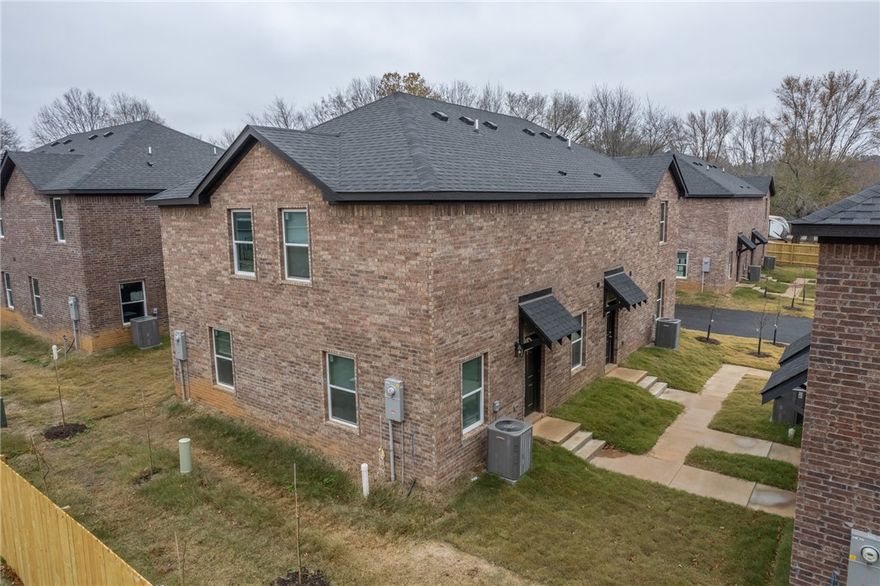 Beautiful new 2 Bedroom / 2.5 Bath Town home located in Fayetteville, with easy access to the U of A, shopping, and I-49. Rent includes lawn care, water, sewer and trash! This modern and stylish town home is perfect for those seeking a comfortable and convenient living space. With two spacious bedrooms and two and a half bathrooms, this town home offers ample space for you to relax and unwind. The open floor plan creates a seamless flow between the living, dining, and kitchen areas, making it perfect for entertaining guests or simply enjoying a quiet night in. The kitchen is equipped with modern appliances and plenty of storage space. Approved pets with a $500.00 non-refundable pet fee and monthly pet rent of $25.00/pet. Breed restrictions apply. Easy access to U of A transit system.