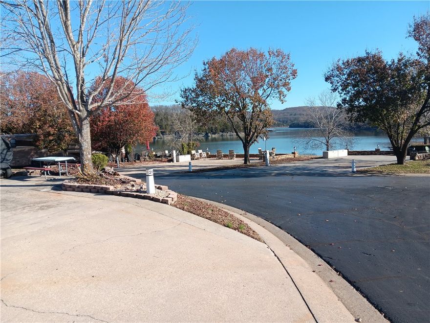 Corner Lot with Water front view from several locations on the lot. Ozark Luxury Resort at Table Rock Lake offers full hook ups, gorgeous water features and too many amenities to list. From Fishing to card games, you'll want to explore the RV life style. Sit on the spacious patio area and feel the stress and tension melt away with your favorite beverage. Several shade trees to relax under and plenty of space for littles ones or fur babies. Make this your spot to run away to. Branson is just 30 minutes drive Welcome to the Lake