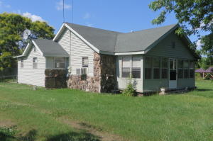 Come Home to the Country!! Pleasant County home encircled by wide open spaces. Large and spacious with multiple out buildings and many many possibilities. Priced with plenty of room for your own personal updates.