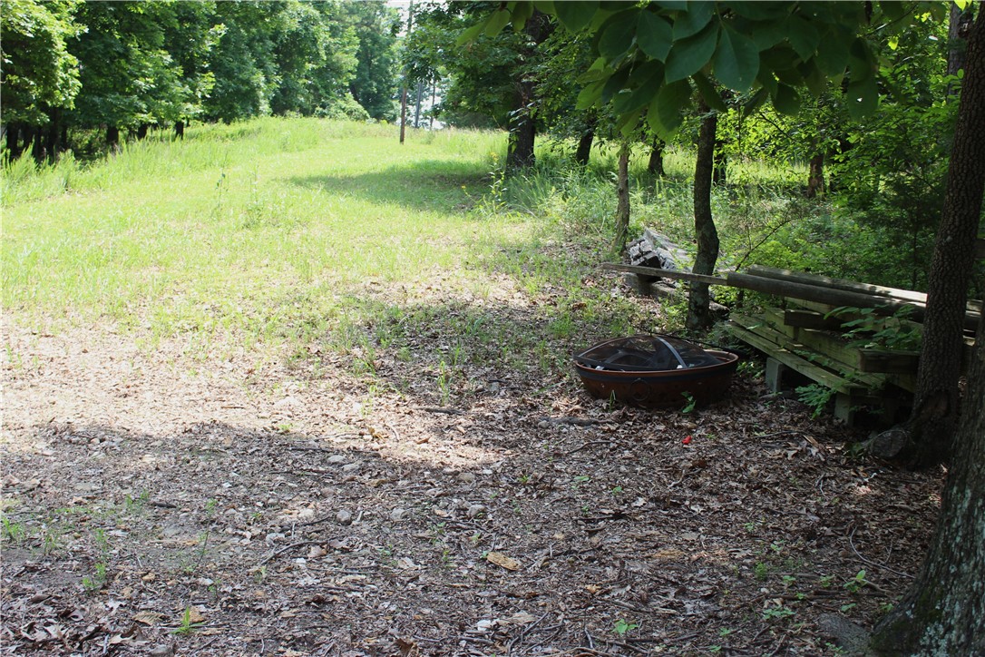 Nice 4.92 acres. Has unfinished 220 sq ft Tiny home. Finish out or build your dream home. Not Far from Beaver Lake access in 2 directions. Peaceful, quite country setting for full time or cabin. The area is surrounded by Hobbs State Park WMA so the roads are well maintained. Hobbs is the largest state park in Arkansas, the 12,054-acre park spans the southern shore of Beaver Lake. The park includes over 36 miles of trails for hiking, mountain biking, horseback riding, campsites, an outdoor shooting range (closed on Mondays for maintenance), an interactive visitor center, and is the only state park in Arkansas to allow regulated hunting.The property abuts Hobbs on the North boundary. Equal distance to Rogers or Eureka Springs. Two 10 X 16 storage Buildings available for extra $$, or they will be moved prior to closing.