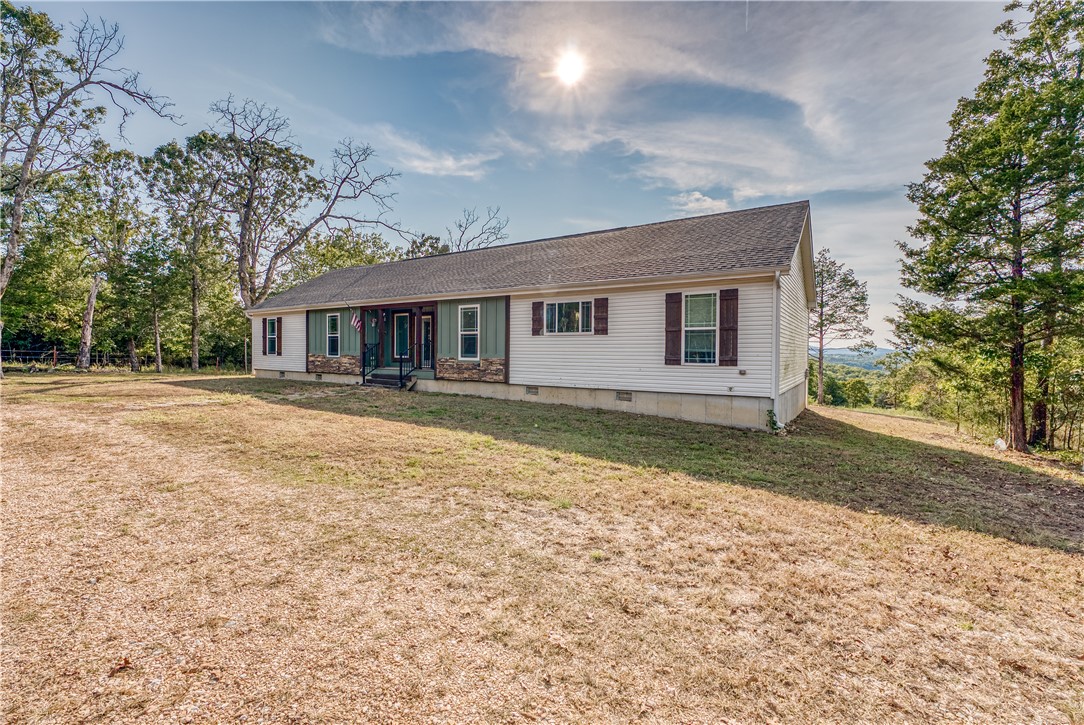 GORGEOUS LAKE VIEW! Tucked away at the end of the road is this spacious modern modular home with room for everyone! Nestled on 10 acres, that joins the Corp Line at the bottom, this 4 BR 2 BA home has everything you need to start living your best life at the lake. Once you finish admiring the beautiful views of Bull Shoals Lake from the back deck, step inside to find your gorgeous kitchen with room to cook for the whole family plus their friends, the inviting wood burning fireplace for those chilly winter days and a master closet that is big enough for a whole additional bedroom! Lake properties are getting scarce by the day, don't let this one pass you by.