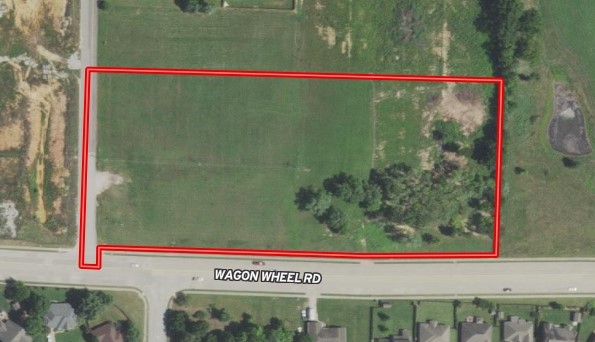 6.74 acres currently zoned C-2 with over 800' of Wagon Wheel frontage. Robins Road is the West boundary for additional access. Close proximity to I-49. Water is on South side of Wagon Wheel. Sewer hook-up is in negotiation. New survey and Geo report are available.