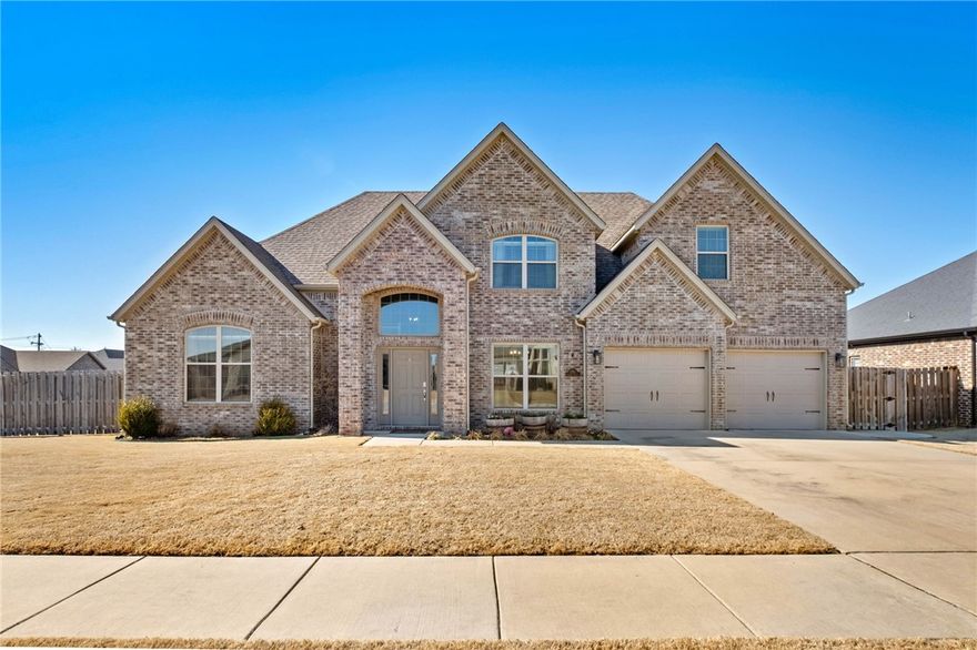 Located on an oversized .31 acre corner lot in sought after Sunrise Ridge, this modern light and bright 4BR/2.5BA all brick home is fully upgraded. East-facing, it welcomes you with a soaring, light filled foyer  & 2nd floor transom window. The open floor plan features a 15.5 ft cathedral ceiling in the family room and a chef's kitchen with 3cm granite, full backsplash, white soft-close cabinets, 5 burner gas stove, wrap-around breakfast bar and undercabinet lighting. The elegant dining room offers a coffered ceiling & wainscotting. The primary suite includes a marble look tile, dual closets, & a designer tiled shower and bath area. Spare bedrooms have large closets and 10 ft ceilings. Enjoy a mud room with built-in bench, oversized laundry, walk-in floored attics, understairs room and an expansive pantry - designed for perfect living. Near Bentonville West and Gamble Elem. A short drive gets you to I-49, Coler, Walmart HQ, DT Bentonville or the airport. Don’t wait to call this home! Ask for detailed feature sheet.