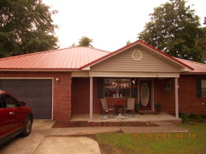 Cute as a button. Don't miss this beautifully decorated home with new heat & air in 2014 and new metal roof in 2013. Possible owner financing with $20,000 down. Full bathroom off of garage. Could easily convert garage to a 3rd bedroom. Covered deck and fenced backyard.