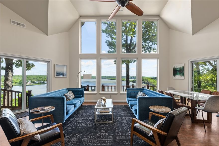 Imagine waking up every morning to panoramic views of Beaver Lake from every room in your home — then checking your VRBO income while guests enjoy the same experience. This fully furnished, off-grid-capable lakefront retreat sits on 9.3 secluded acres with 750 feet of private shoreline, making it one of NW Arkansas's most compelling live-in or investment properties. The custom-built home features soaring 14-foot cathedral ceilings, granite counters, and a split floor plan where all three bedrooms open directly onto a sweeping deck above the water. An 8-person sauna, hot tub, and fire pit keep guests coming back — and the reviews show it. With owned solar panels, a private well, and battery storage, your overhead stays low while your rental appeal stays high. Additional building sites offer room to expand with cabins or a shop. Whether you're seeking a legacy property, a high-performing short-term rental, or both — this estate delivers.