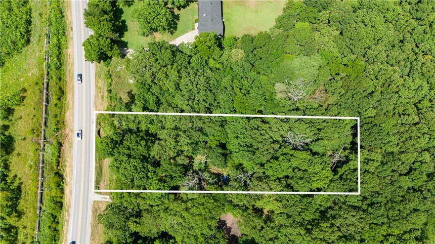 Check out this fantastic 0.78-acre wooded lot on E Huntsville Road, perfectly situated between Fayetteville and Baldwin. This gently rolling, buildable lot offers a great opportunity to create your dream home in a serene, natural setting. With its convenient location, you'll enjoy the peace of the countryside while still being close to all the amenities and attractions that Fayetteville has to offer. Don't miss out on this prime piece of land! Initial stage of rezoning has been completed and will be rezoned RSF-4 December 20th