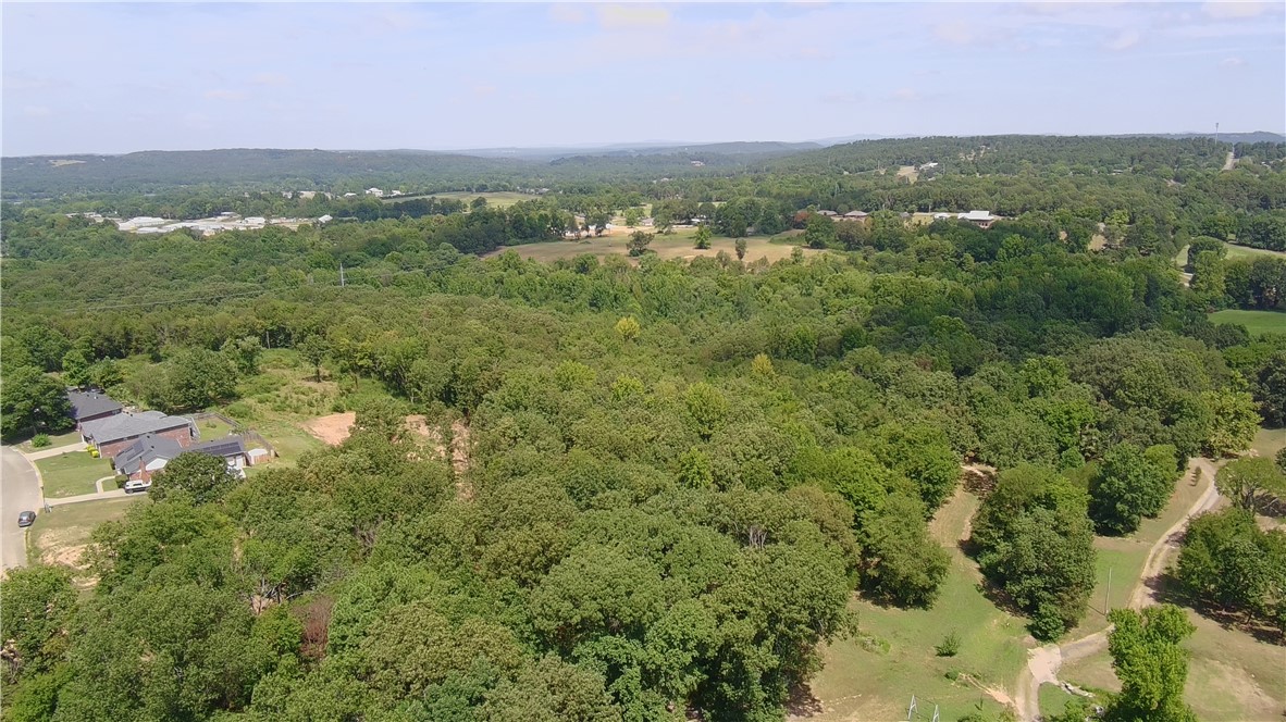 Discover the perfect balance of nature and convenience with this 10-acre parcel in Phase 2 of Huntington Place Subdivision. This prime piece of land offers a mix of cleared and wooded areas, providing multiple ideal building sites for your dream home. With electricity and water already in place, it's ready for development. Located just outside the city limits, enjoy the tranquility of rural living with easy access to urban amenities. Please note: No mobile homes allowed.