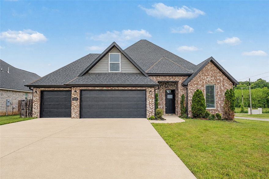 Located in Mill Park Subdivision in Elm Springs, this is the one you've been waiting for! This home sits on a corner lot and offers 4 bedrooms, 2.5 bathrooms.  An office/study with a large closet could be used as a 5th bedroom.  As you walk into the open floorplan the living room opens up with 10 ft ceilings, beautiful wood beams and a gorgeous focal fireplace.  The kitchen has custom inset cabinetry that leads all the way to the ceiling.  An extra island gives the kitchen elegance and provides extra storage and countertop space.   The expansive backyard is a blank canvas to design an outdoor space for all of your outdoor entertaining needs.  This is a prime location in the heart of Northwest Arkansas just minutes away from the new extension of Interstate 612, that when finished will have you at the regional airport in minutes, or connects you to I-49.  At this price, it won't last long.  Schedule your showing today.