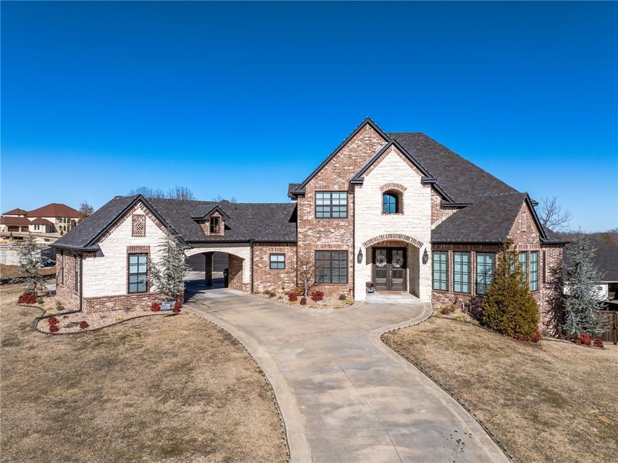 Luxurious newer home built in the gated community of Providence. This 6 bedroom, 4.5 bath, 3-level house boasts of a custom iron railing on the staircase, custom fireplace, granite / quartzite countertops, gas cooktop, with divided silverware drawer and soft close custom cabinets. The kitchen also includes a 13 foot bar with storage, an in-counter downdraft, an ice machine and Frigidaire professional series appliances. A downstairs office has a built-in desk, and there is a hidden room under the stairway accessible by a built-in bookcase. The main bedroom has a built-in platform bed base, nightstands, bookshelves and ensuite bath with a 5 ft long air masseur bathtub and a large walk-in closet Downstairs has a separate living quarters with a kitchenette and bathroom in addition to a home theater room with custom shelving. In back is a beautiful salt-water pool, 3-5 feet deep, 2 laminar fountains, in-floor cleaning system and rock wall with waterfall. PROOF OF FUNDS MUST be provided prior to scheduling a showing.